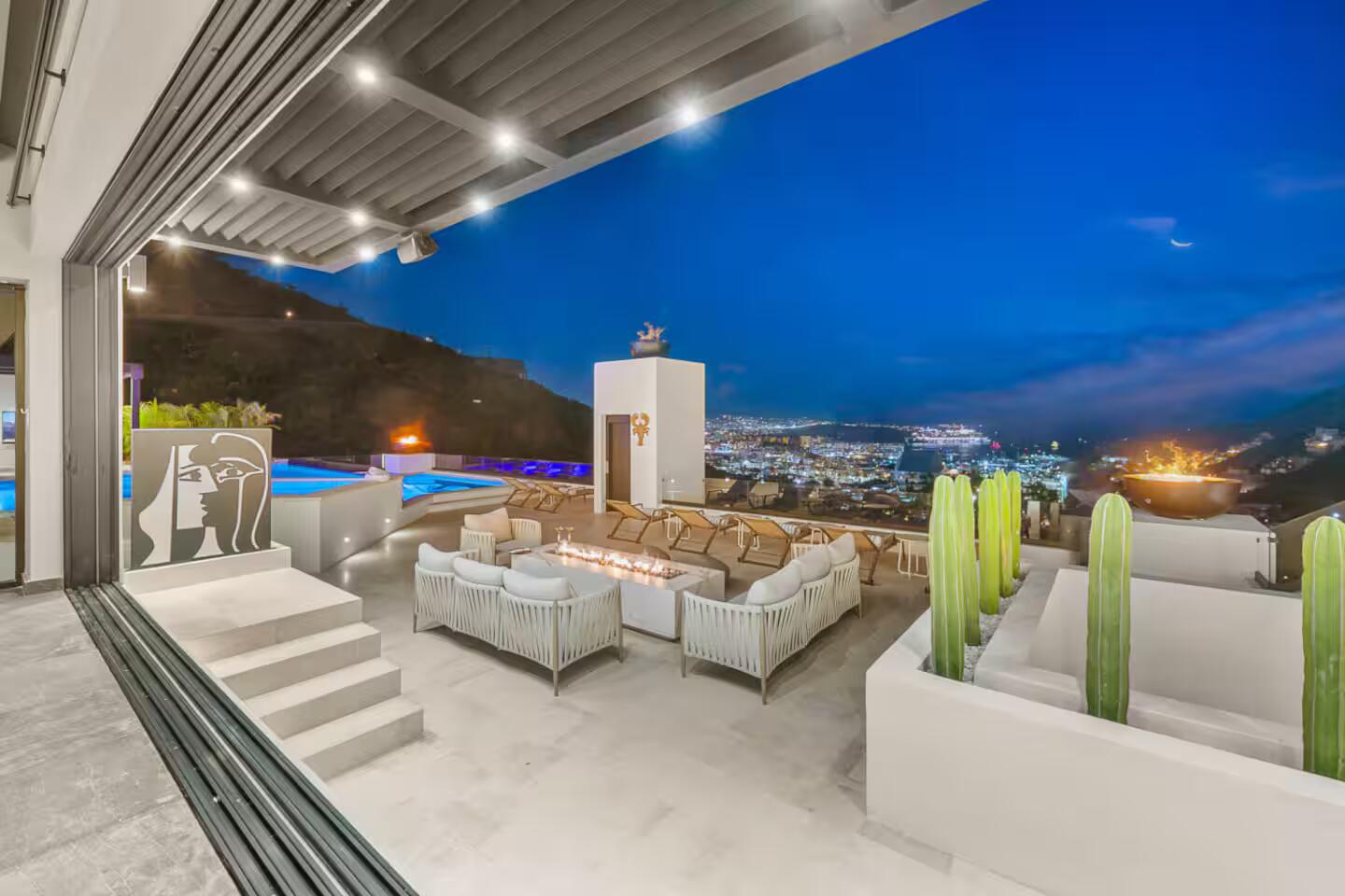 Evening terrace with fire bowls overlooking Cabo San Lucas